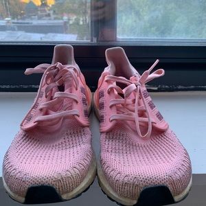 Well-worn Adidas running shoes